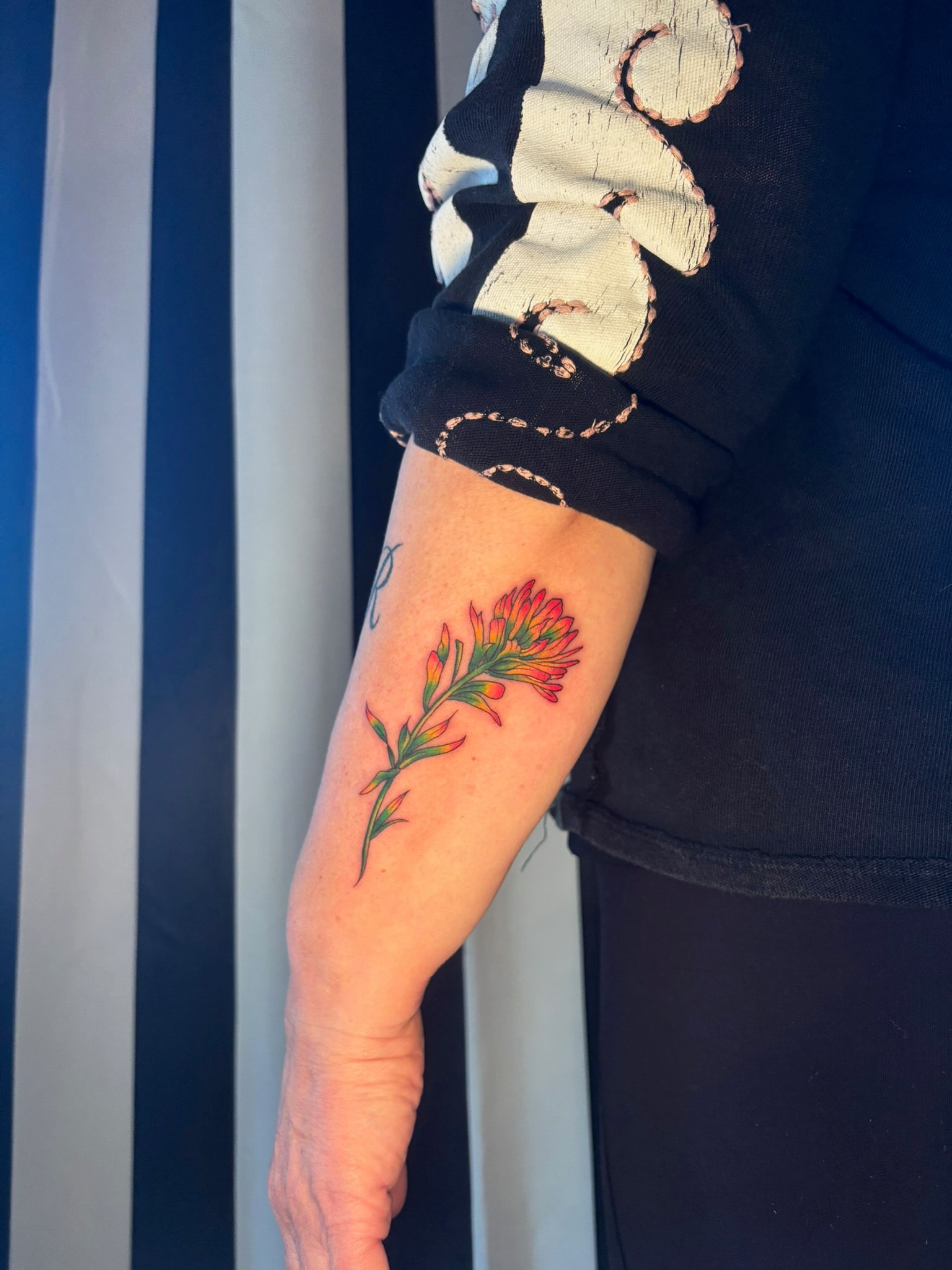 Tattoo on arm, black and grey